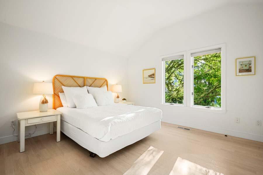 27 Ocean Bluff Drive Mashpee, MA 02649 - Photo 48 of 55 a bedroom with a bed lamp and window