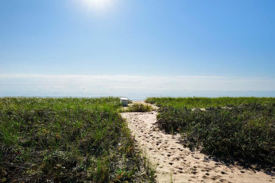 27 Ocean Bluff Drive Mashpee, MA 02649 - Photo 6 of 55 a view of a lake with a city