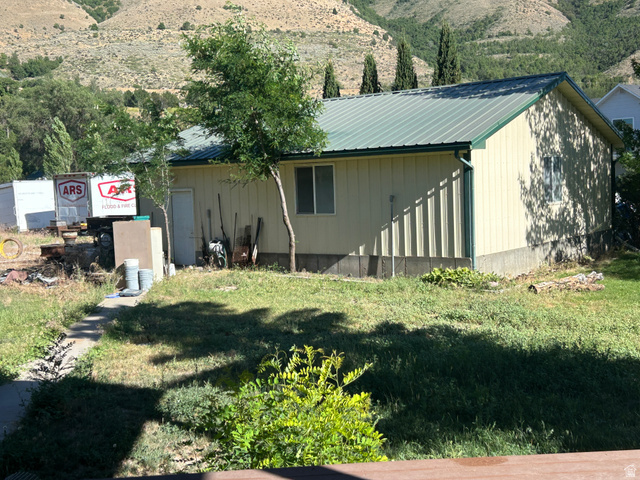 2688 Read Lane Preston, ID 83263 - Photo 18 of 18 Cream-colored siding building featuring a green metal roof and white trim