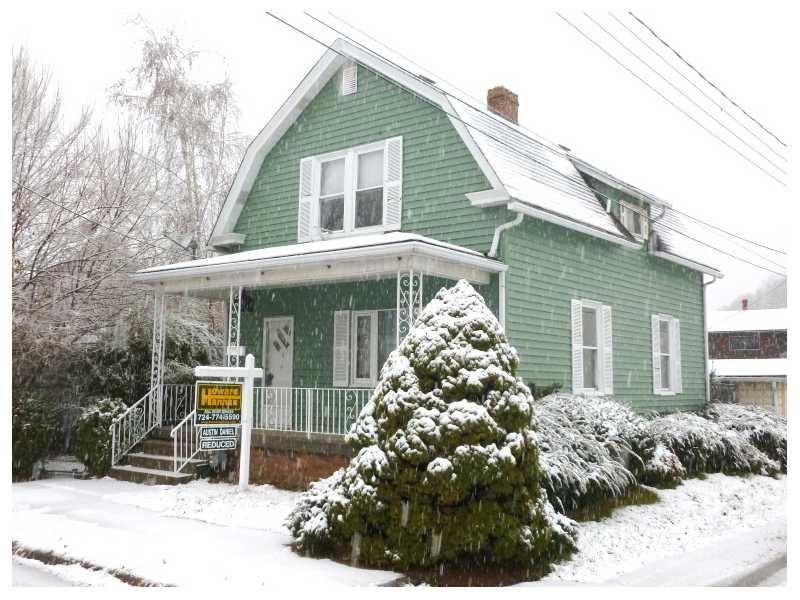 Exterior Front. Curb appeal: Corner lot 2 story with mature shrubs & trees