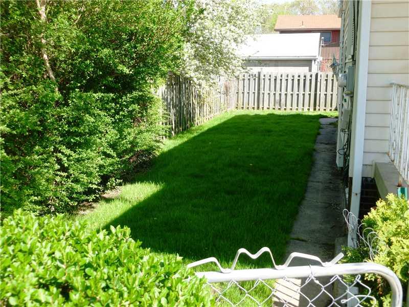 514 21st Street Beaver Falls, PA 15010 - Photo 5 of 18 Yard/Garden. Fully fenced in side yard to rear leads to rear covered porch & garage with gates in front and rear