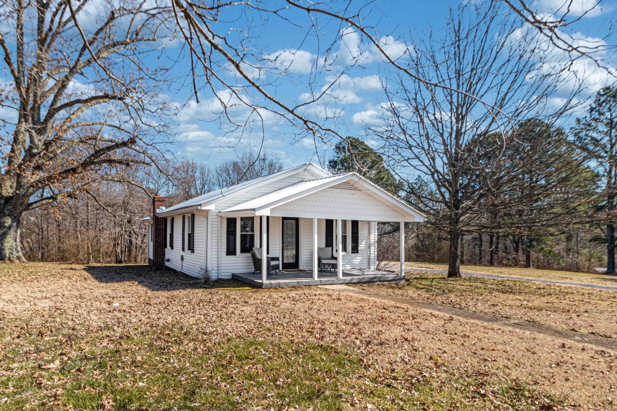 8144 Spot Light Road Lyles, TN 37098 - Photo 3 of 24 a front view of a house with a yard