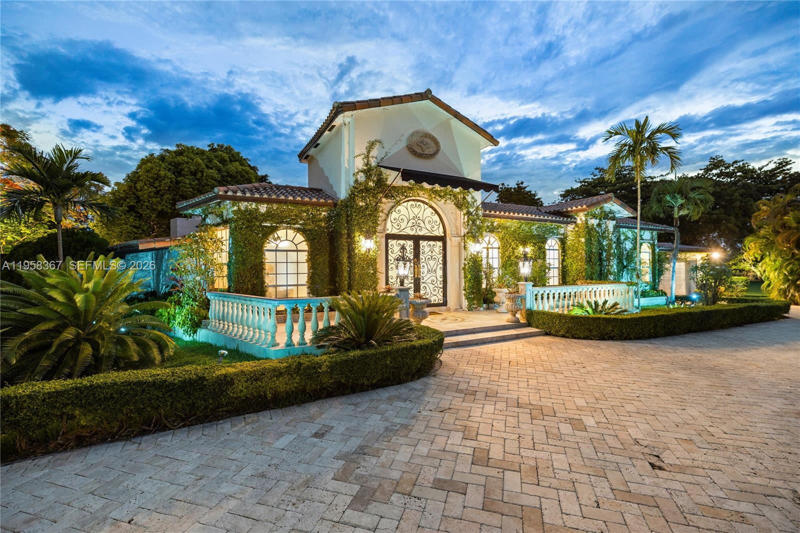 12300 Old Cutler Road, Unit 1 Pinecrest, FL 33156 - Photo 2 of 39 a view of a house with a garden