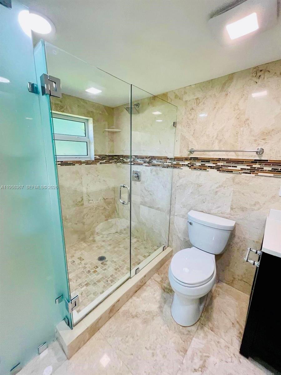 12300 Old Cutler Road, Unit 1 Pinecrest, FL 33156 - Photo 22 of 39 a bathroom with a toilet and a shower