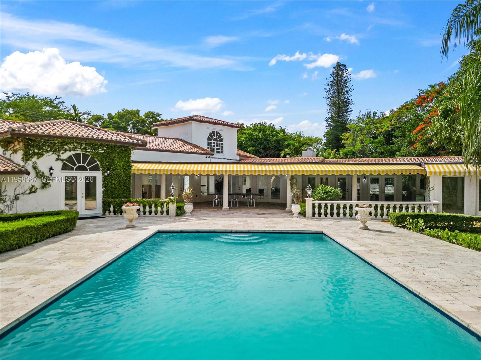 12300 Old Cutler Road, Unit 1 Pinecrest, FL 33156 - Photo 30 of 39 an outdoor view of house with swimming pool and garden