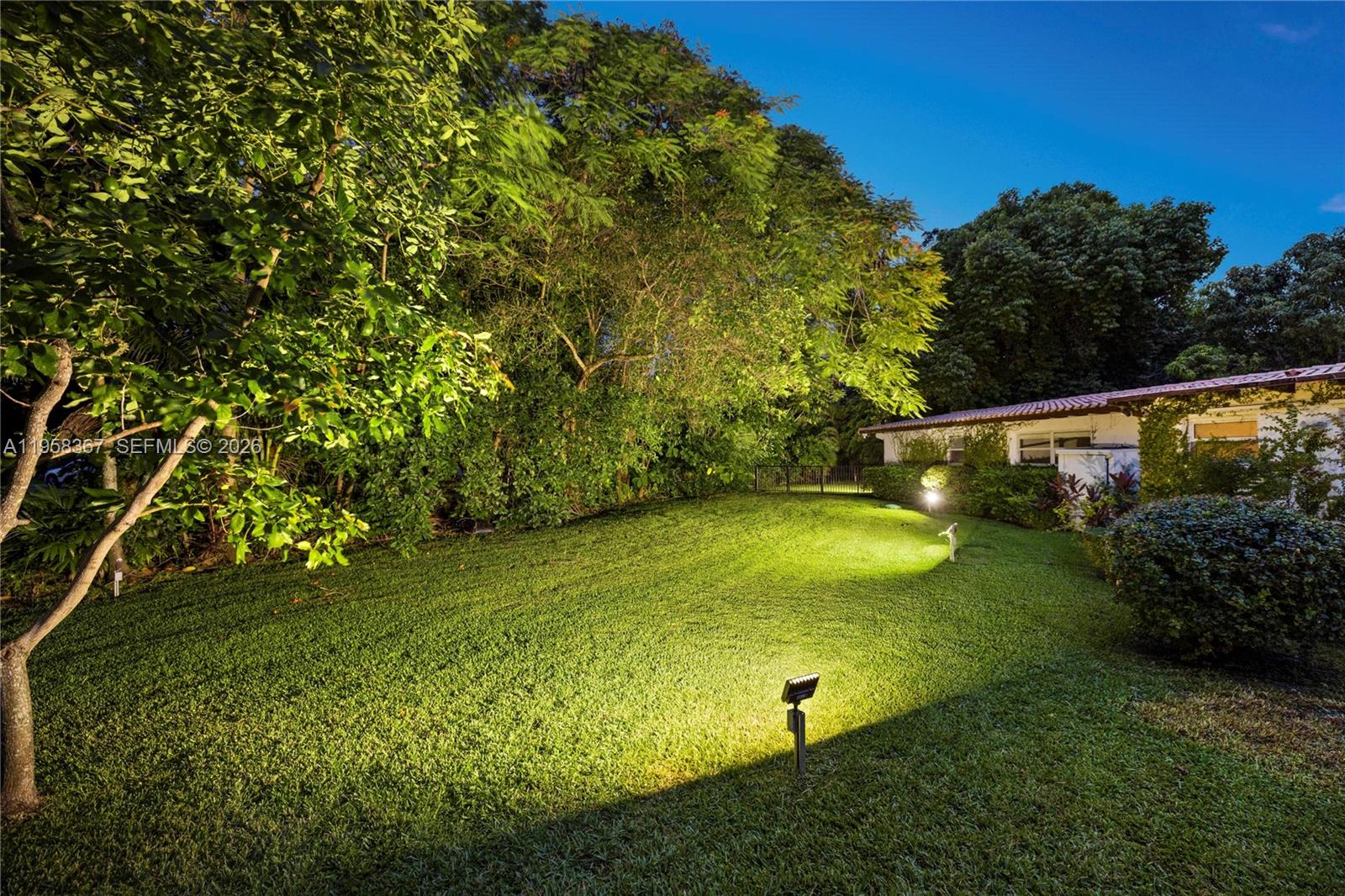 12300 Old Cutler Road, Unit 1 Pinecrest, FL 33156 - Photo 38 of 39 a view of an outdoor space and a yard