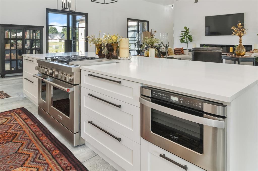 255 Private Road 5941 Emory, TX 75440 - Photo 11 of 39 Kitchen with white cabinetry, double oven range, hanging light fixtures, and oven