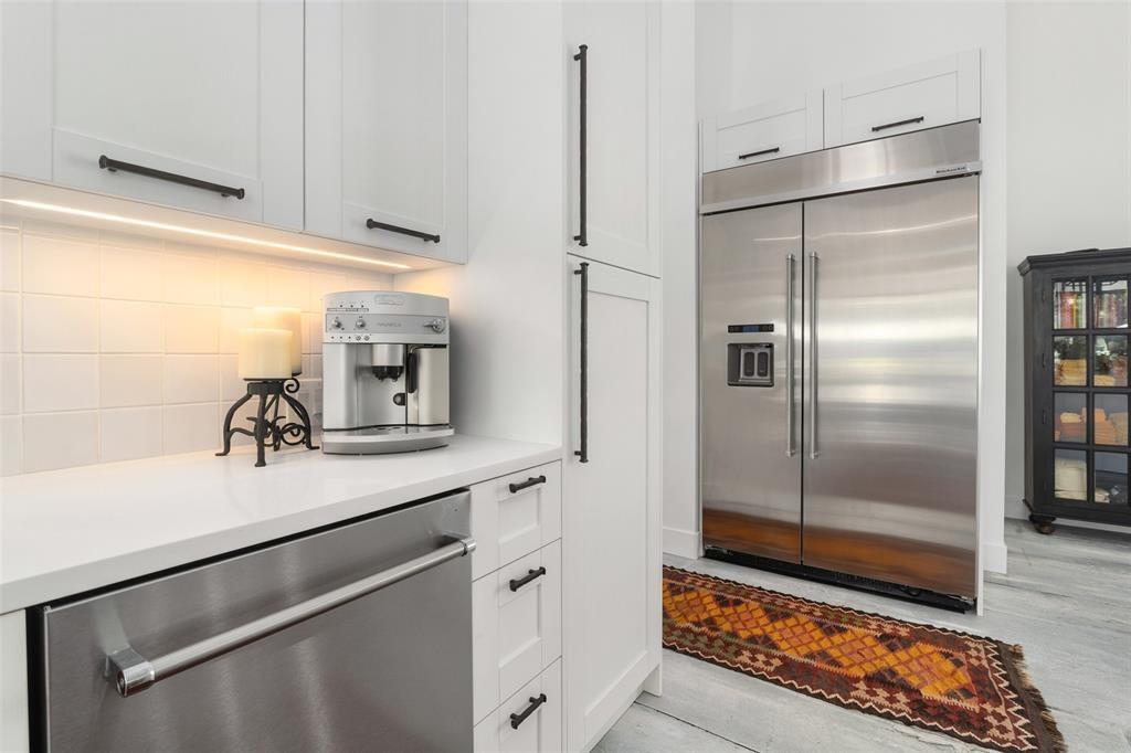 255 Private Road 5941 Emory, TX 75440 - Photo 13 of 39 Kitchen featuring decorative backsplash, stainless steel appliances, and white cabinets
