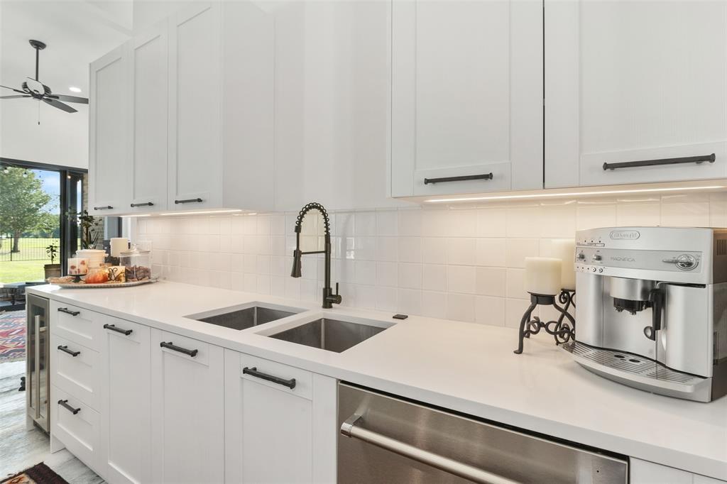 255 Private Road 5941 Emory, TX 75440 - Photo 15 of 39 Kitchen with white cabinetry, sink, decorative backsplash, and dishwasher