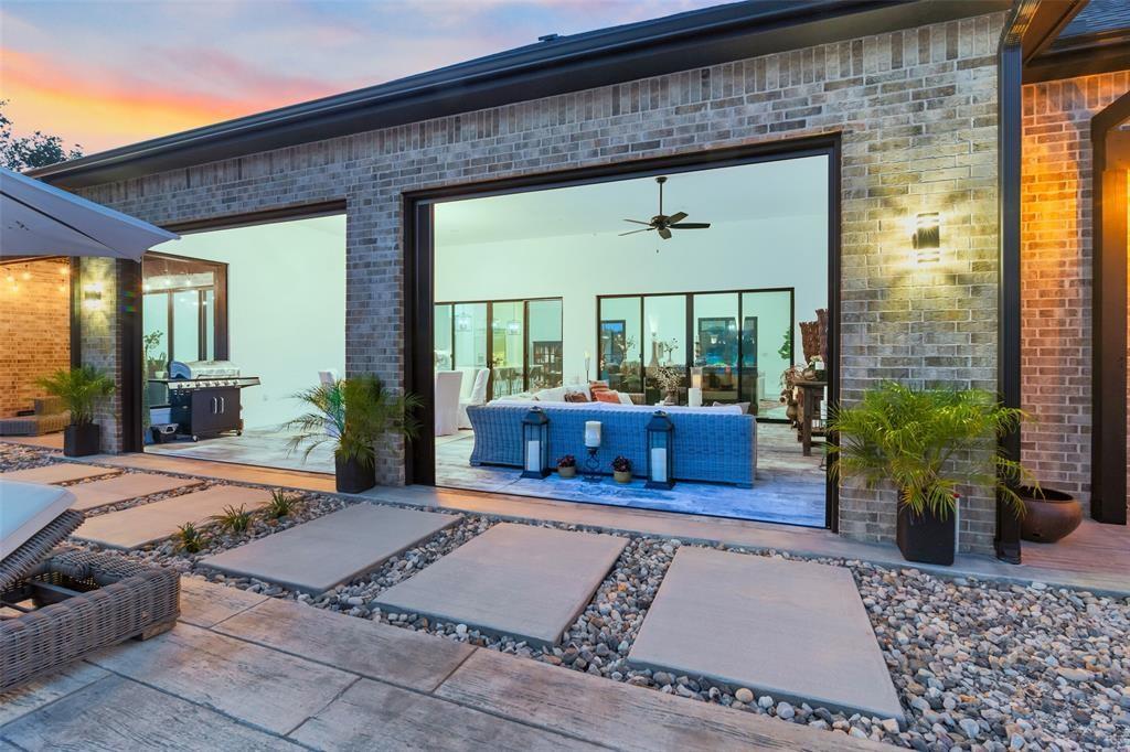 255 Private Road 5941 Emory, TX 75440 - Photo 34 of 39 Exterior entry at dusk featuring an outdoor living space, a patio, and ceiling fan