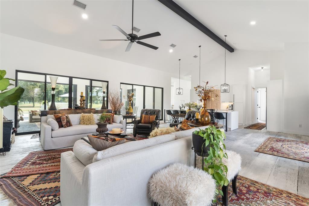 255 Private Road 5941 Emory, TX 75440 - Photo 7 of 39 Living room featuring ceiling fan, beam ceiling, high vaulted ceiling, and light hardwood / wood-style flooring