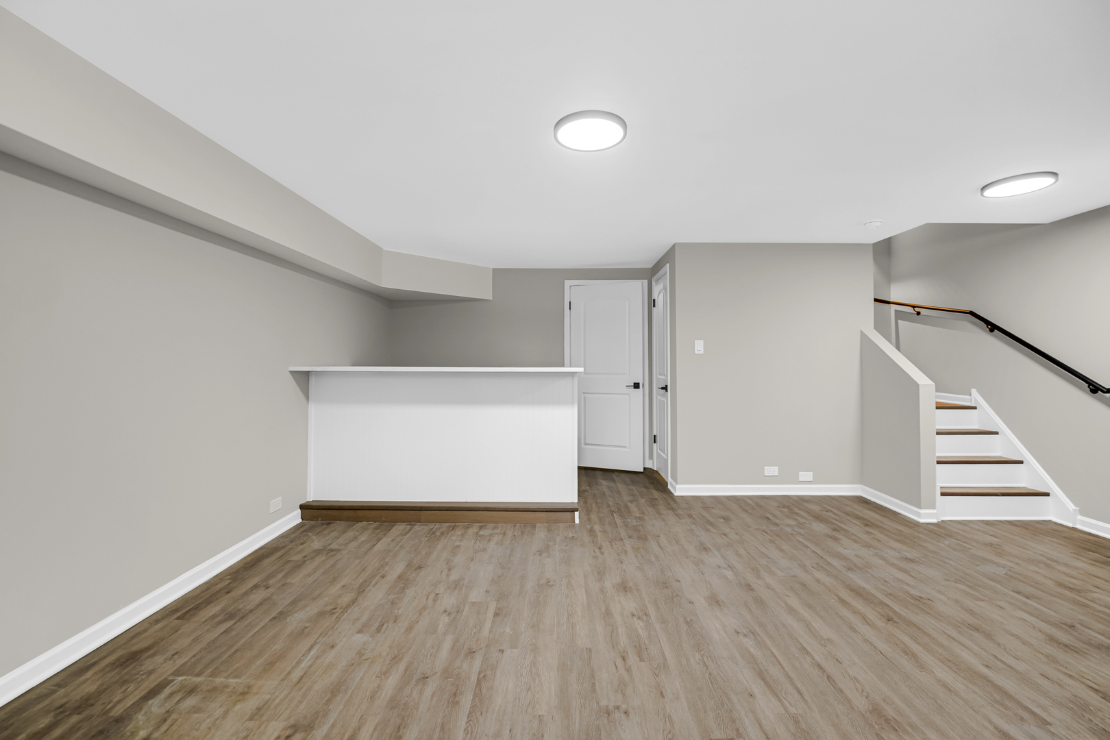 1602 West 103rd Street Chicago, IL 60643 - Photo 17 of 22 a view of an empty room with wooden floor and stairs