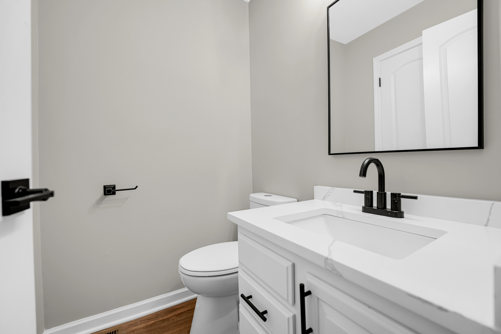 1602 West 103rd Street Chicago, IL 60643 - Photo 6 of 22 a bathroom with a sink a toilet and mirror