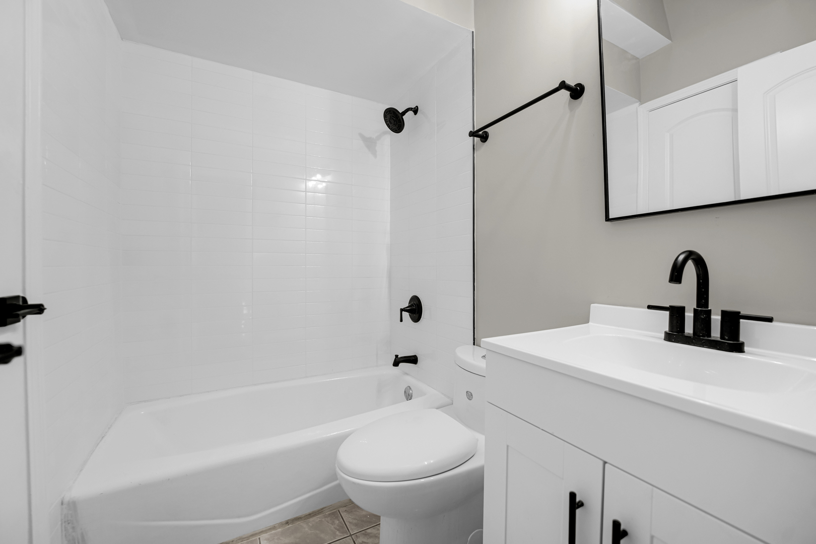 1602 West 103rd Street Chicago, IL 60643 - Photo 7 of 22 a bathroom with a sink a toilet and a bathtub
