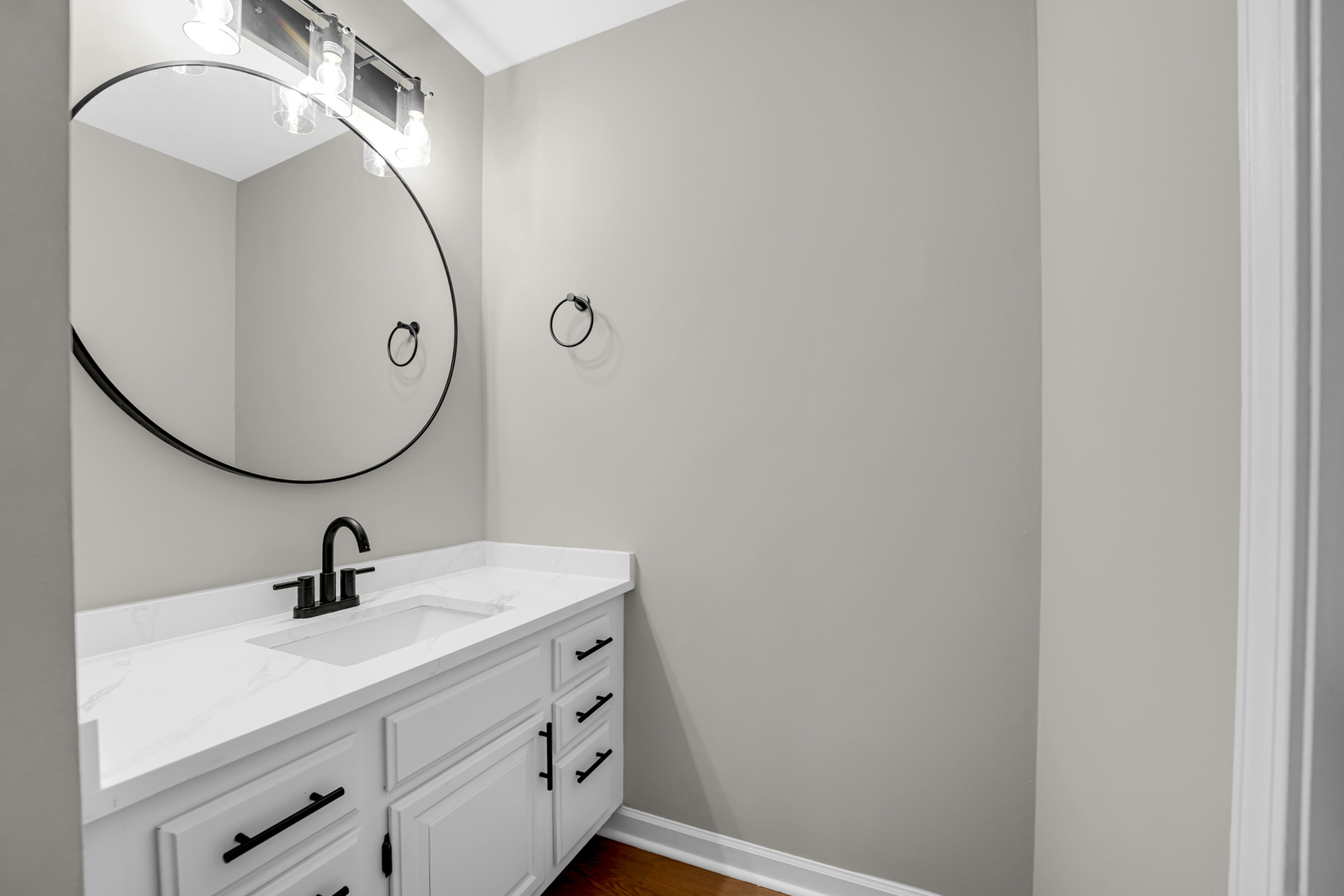 1602 West 103rd Street Chicago, IL 60643 - Photo 8 of 22 a bathroom with a sink and mirror