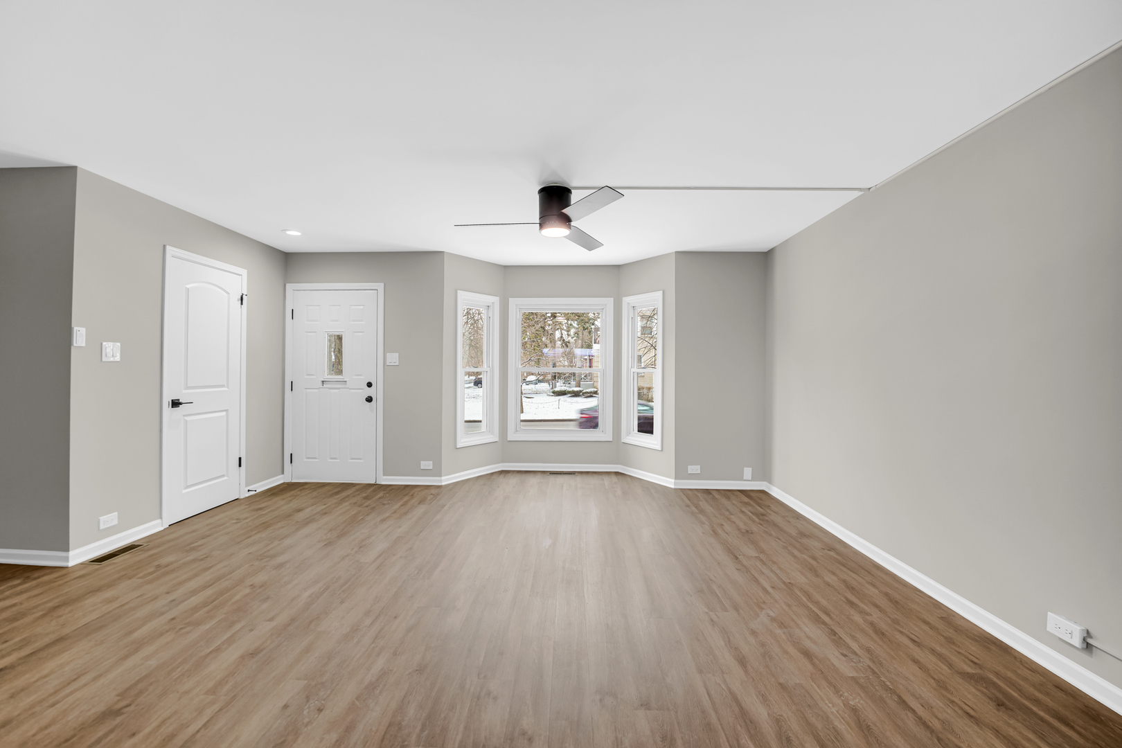 1602 West 103rd Street Chicago, IL 60643 - Photo 9 of 22 a view of an empty room with window and wooden floor