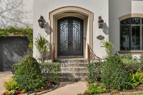 a front view of a house with garden