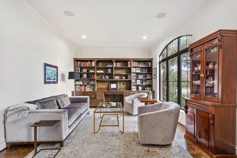 a work room with furniture and a book shelf