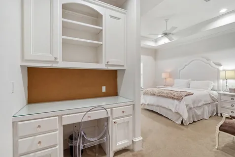 a bedroom with bed and window