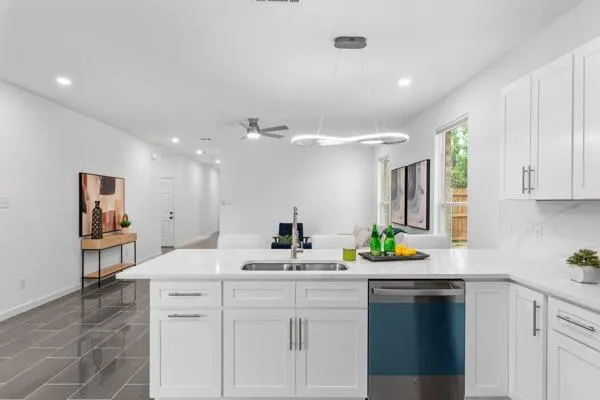 a kitchen with a sink and cabinets