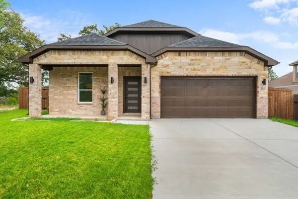 front view of a house with a garden