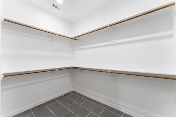 a view of a hallway with closet