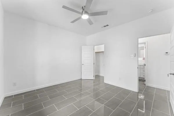 a bathroom with a double vanity sink and mirror