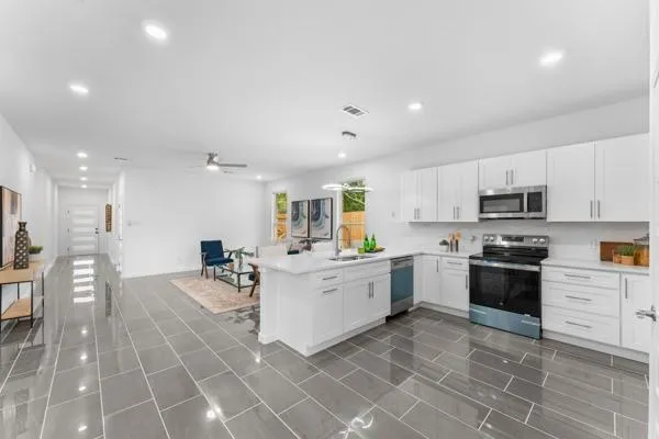 an aerial view of multiple houses with yard