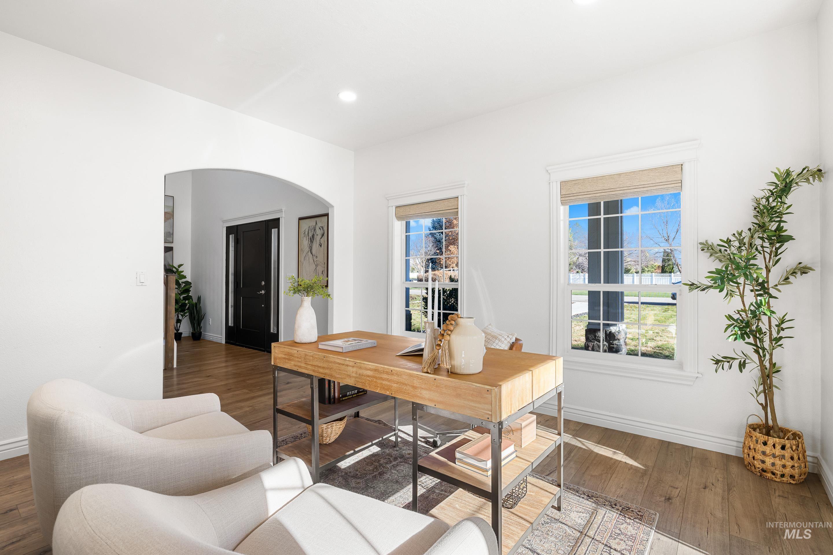 1197 North Cove Colony Way Eagle, ID 83616 - Photo 14 of 50 Office featuring arched walkways, hardwood / wood-style floors, and recessed lighting