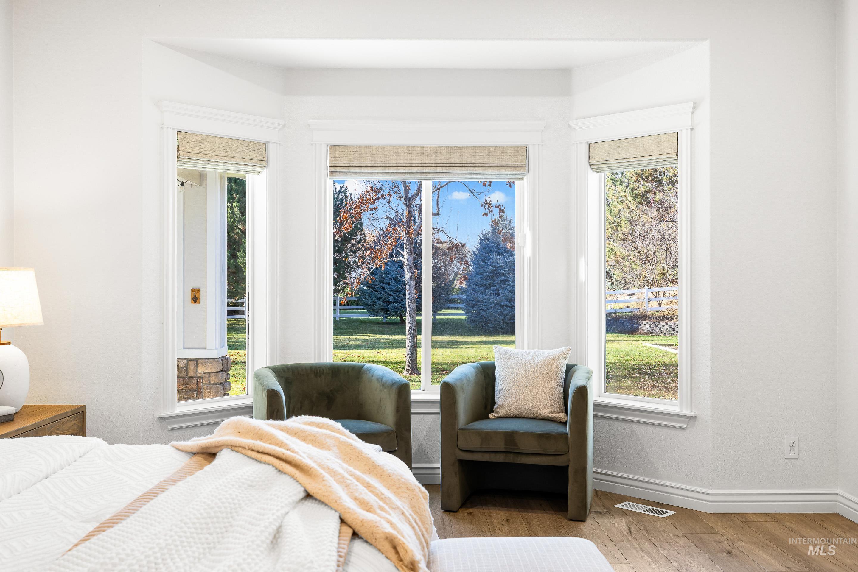 1197 North Cove Colony Way Eagle, ID 83616 - Photo 28 of 50 Bedroom with hardwood / wood-style floors and baseboards