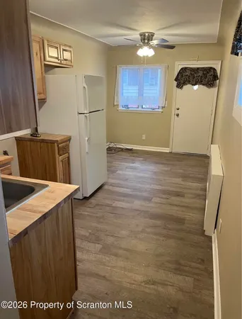 a view of a storage & utility room with a sink