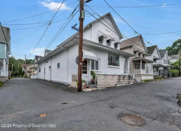 a view of a house with a street