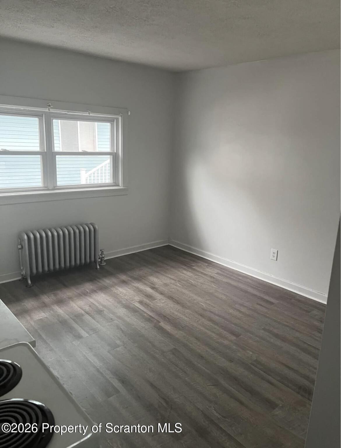 3 Ferguson Place Dunmore, PA 18509 - Photo 23 of 24 a view of an empty room with wooden floor and a window