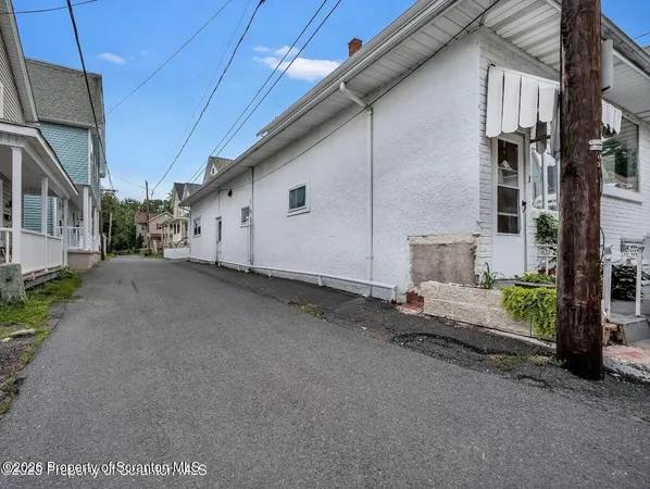 a view of a house with a street