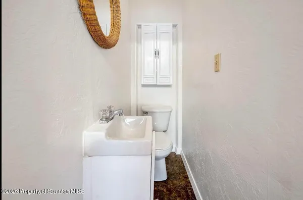 a bathroom with a sink and mirror