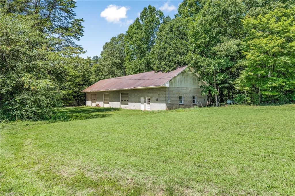 4600 Warner Road Pfafftown, NC 27040 - Photo 3 of 31 100' X 30' building on property feauturing 3 garages, (bays)built-in shelving, office space, bath, meeting room, break room