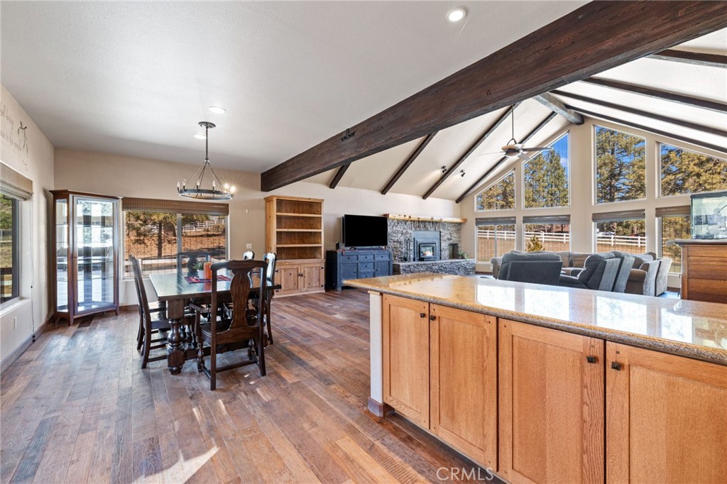 59331 Devils Ladder Road Mountain Center, CA 92561 - Photo 15 of 74 a view of a dining room with furniture window and wooden floor