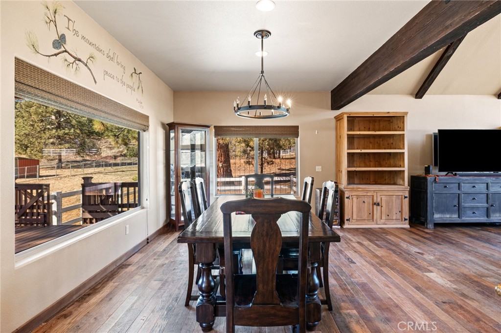 59331 Devils Ladder Road Mountain Center, CA 92561 - Photo 16 of 74 a view of a dining room with furniture window and wooden floor