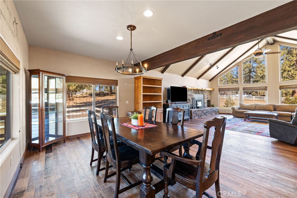 59331 Devils Ladder Road Mountain Center, CA 92561 - Photo 25 of 74 a view of a dining room with furniture window and wooden floor