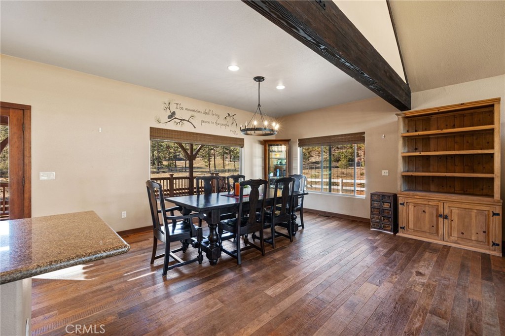 59331 Devils Ladder Road Mountain Center, CA 92561 - Photo 26 of 74 a view of a dining room with furniture window and wooden floor
