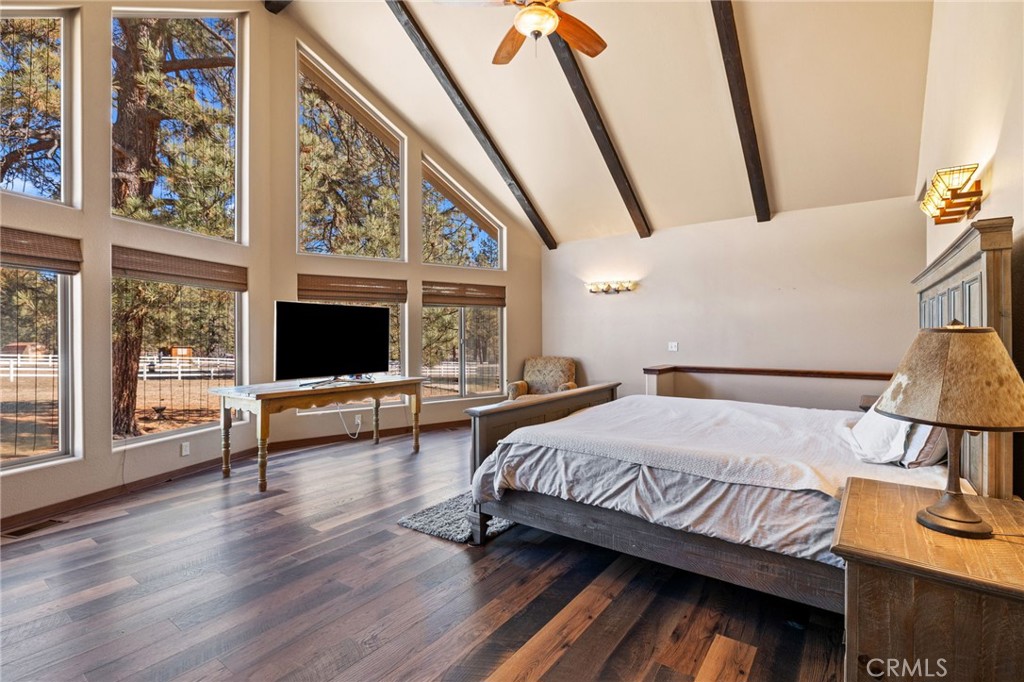 59331 Devils Ladder Road Mountain Center, CA 92561 - Photo 27 of 74 a bedroom with a bed and a flat tv screen on the dresser