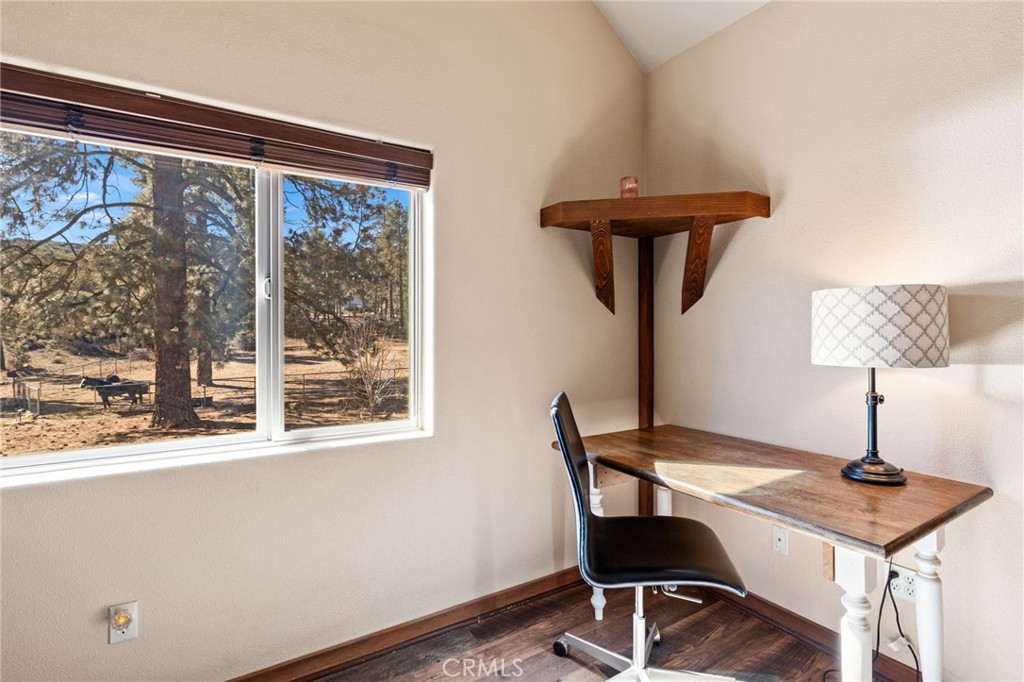 59331 Devils Ladder Road Mountain Center, CA 92561 - Photo 30 of 74 a view of a workspace with furniture and a window