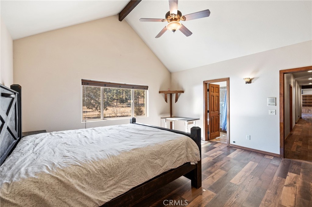 59331 Devils Ladder Road Mountain Center, CA 92561 - Photo 33 of 74 a bedroom with a bed a dresser and a window