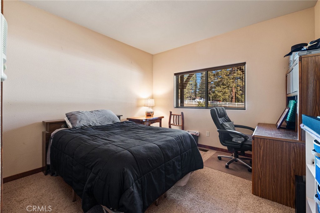 59331 Devils Ladder Road Mountain Center, CA 92561 - Photo 40 of 74 a bedroom with a bed and a desk