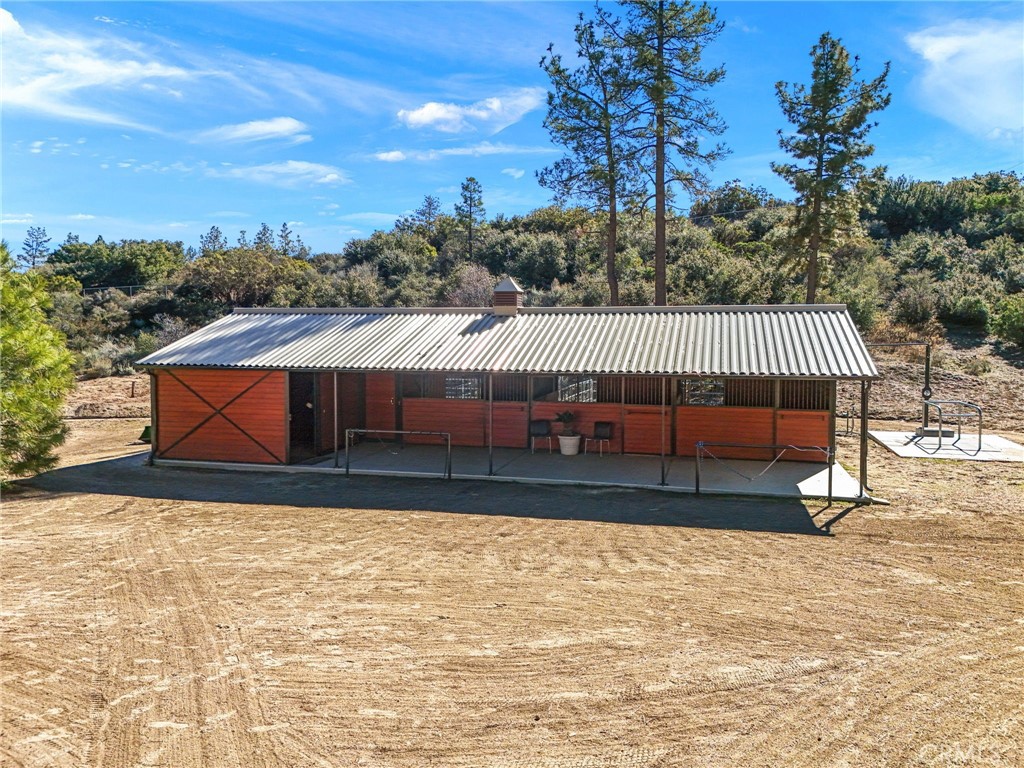 59331 Devils Ladder Road Mountain Center, CA 92561 - Photo 51 of 74 a view of a house with a yard