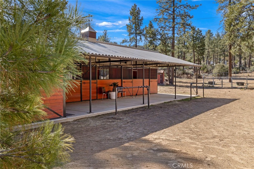 59331 Devils Ladder Road Mountain Center, CA 92561 - Photo 56 of 74 a backyard of a house with barbeque oven table and chairs
