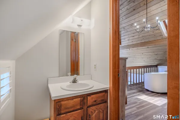 a view of a hallway with furniture and front door