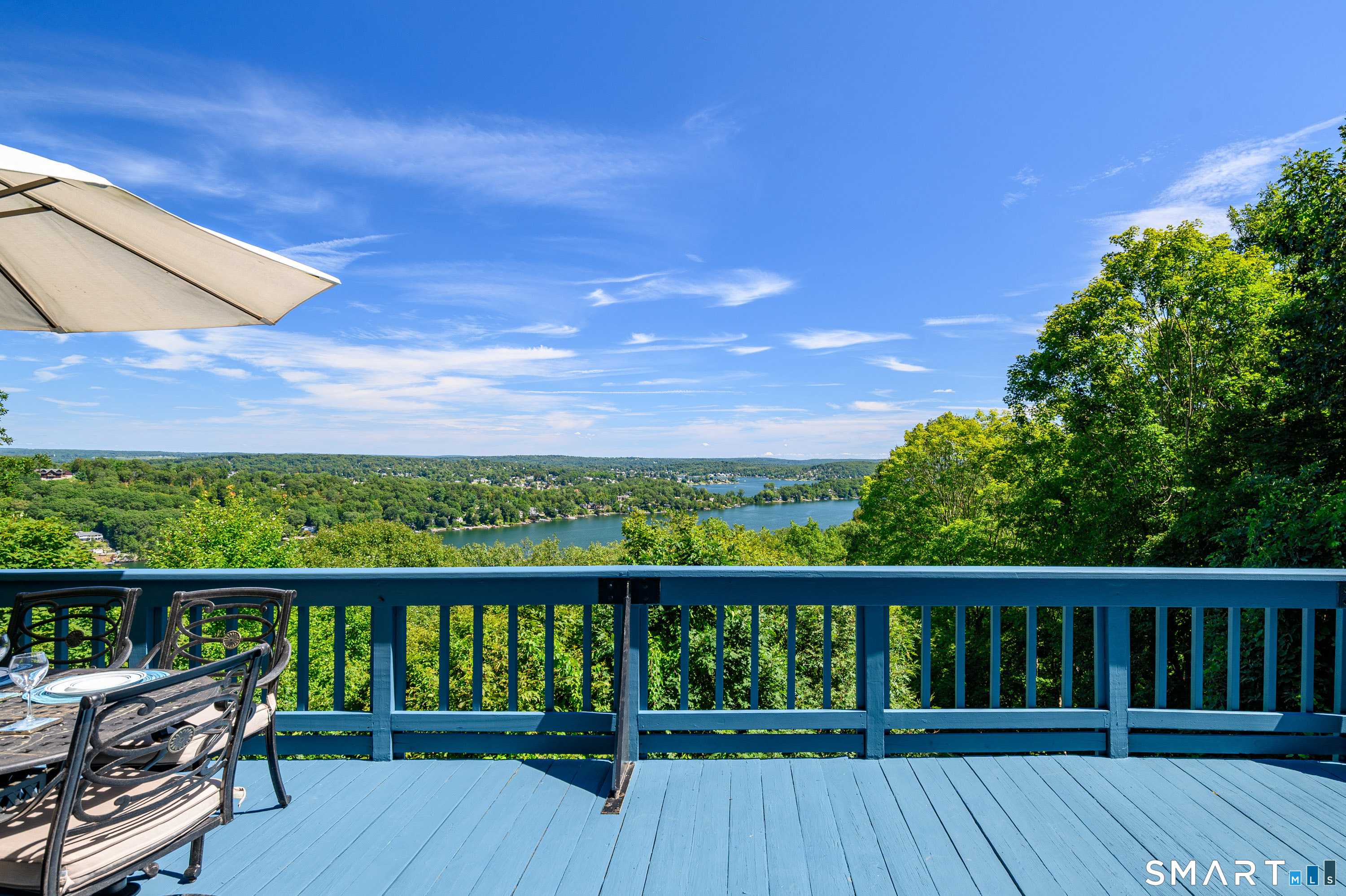 3 Spring Wood Lane New Fairfield, CT 06812 - Photo 15 of 28 a view of a balcony with wooden floor and outdoor seating