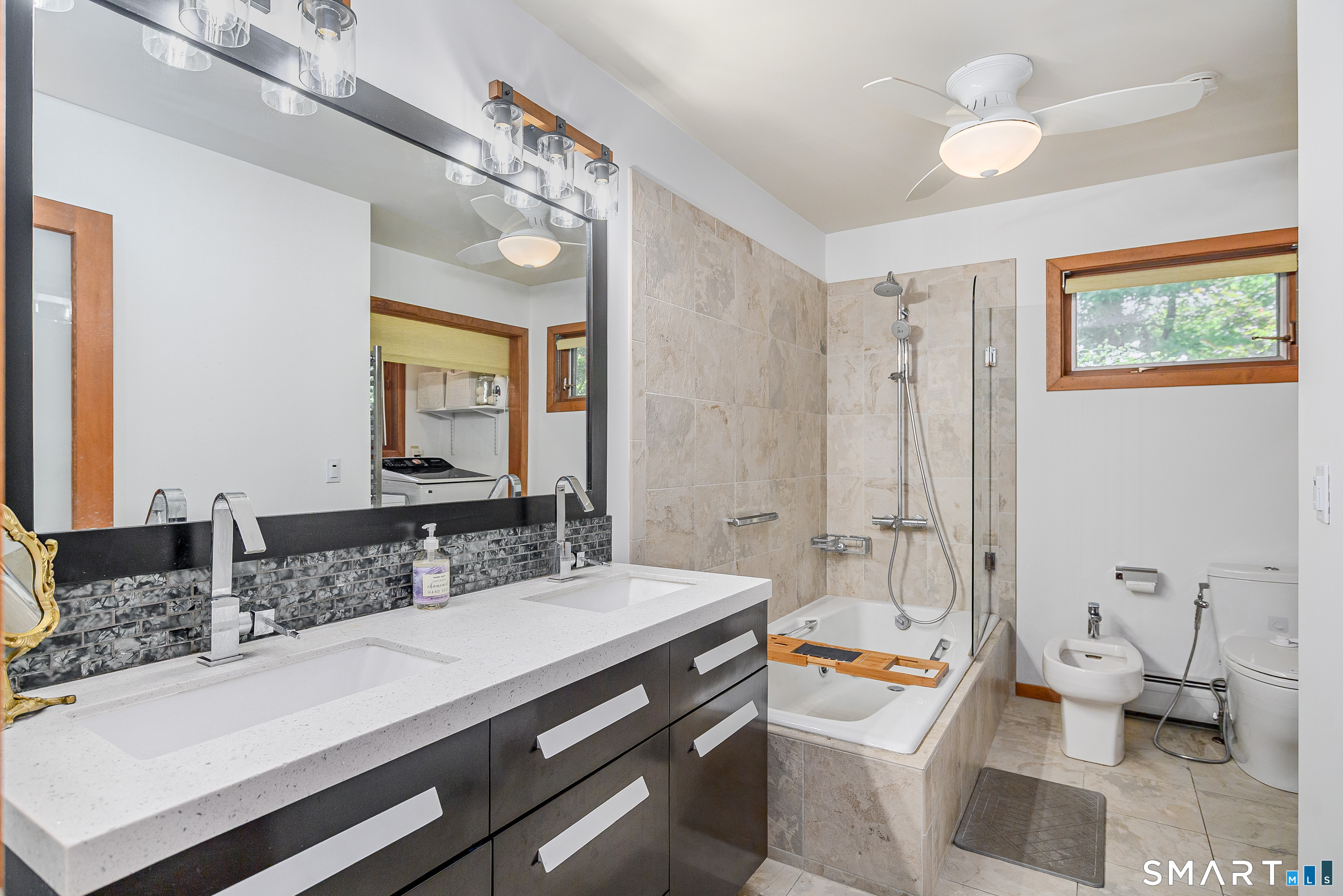 3 Spring Wood Lane New Fairfield, CT 06812 - Photo 5 of 28 a spacious bathroom with a double vanity sink toilet and a mirror