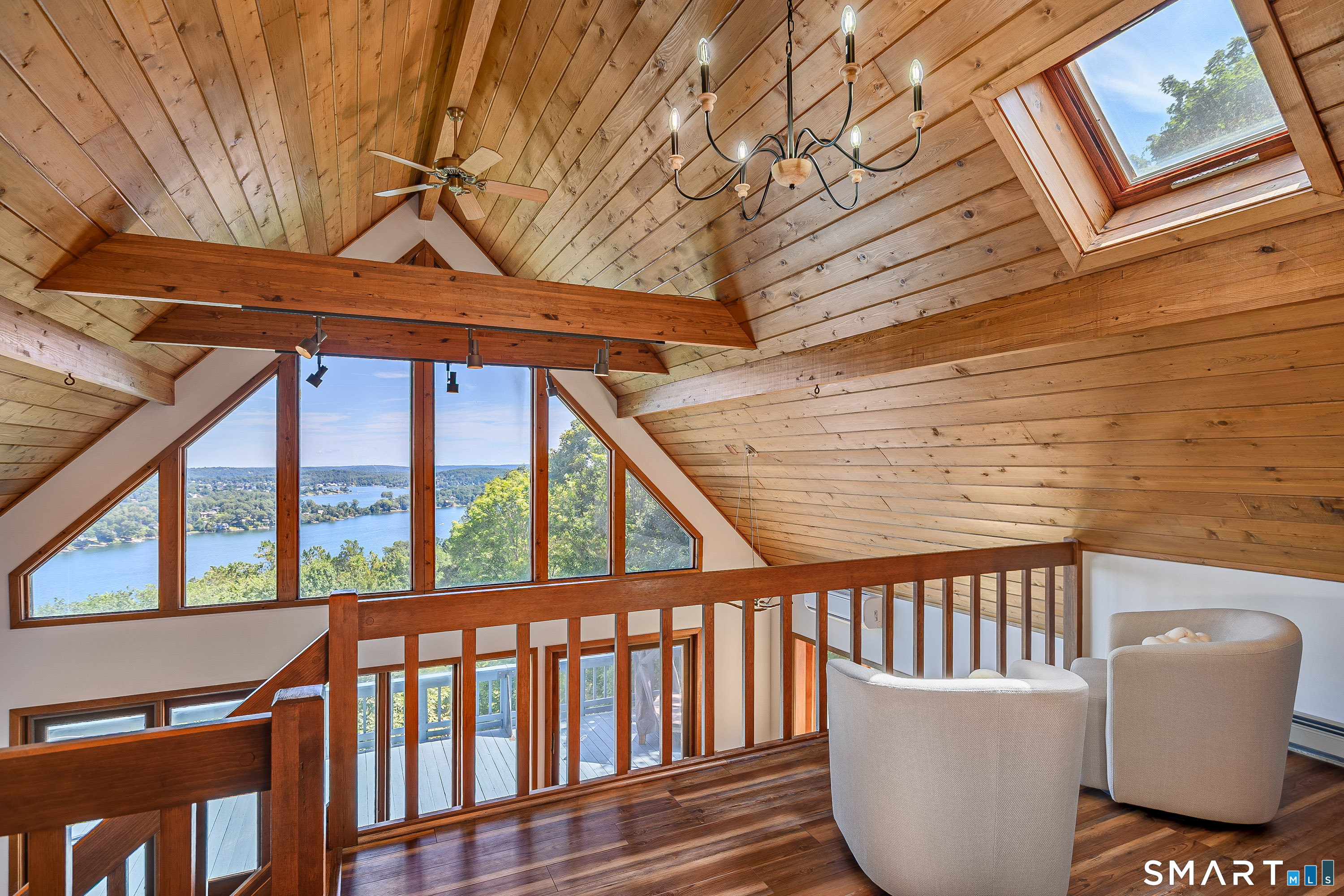 3 Spring Wood Lane New Fairfield, CT 06812 - Photo 8 of 28 a view of a chair and table in the balcony